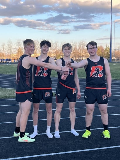 four high school track athletes
